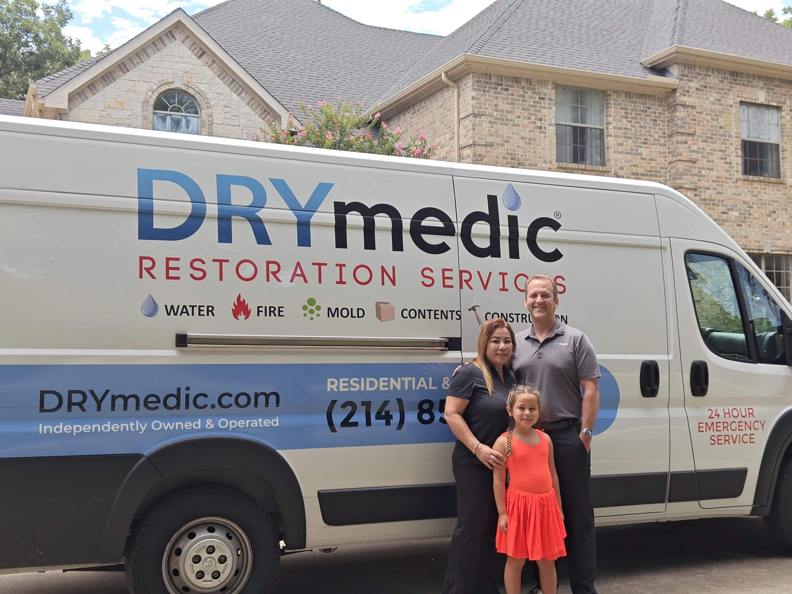 A family smiling next to each other