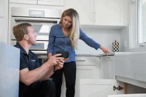 a person looking at a person in a kitchen