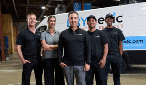 DRYmedic team standing in front of a white vehicle team standing in front of a white vehicle