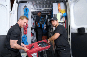 DRYmedic team lifting equipment out of truck